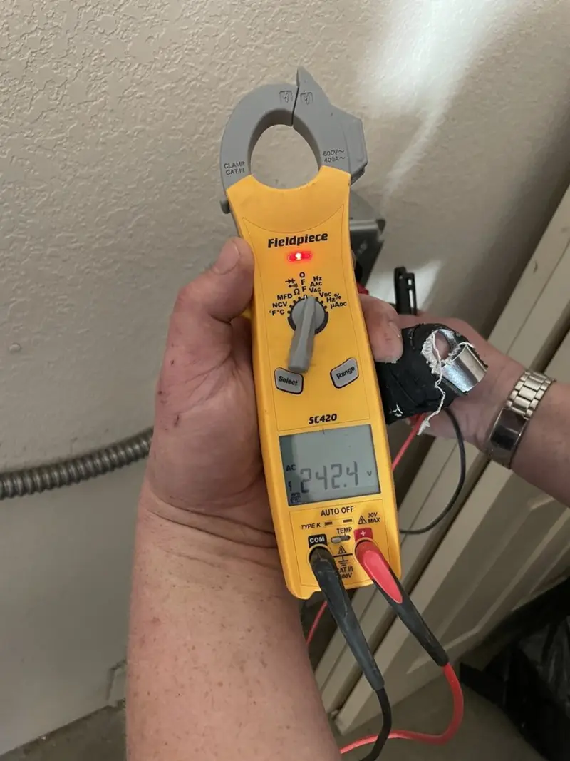 Voltage testing with clamp meter during Outlet Installation in Plainfield
